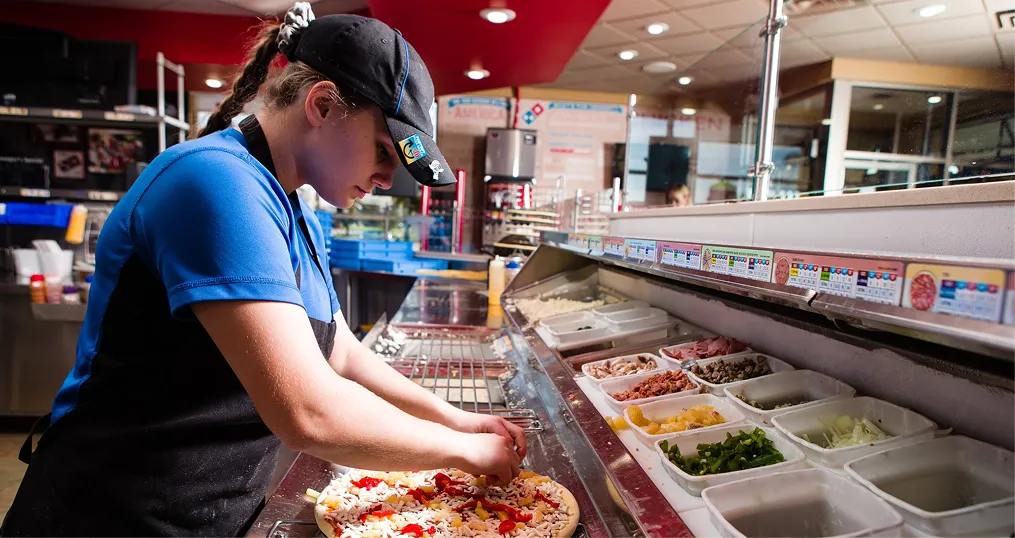 Domino's pizza making close up