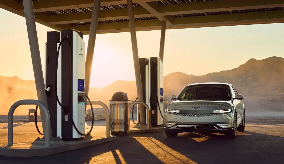 Electrify America charging station at sunset
